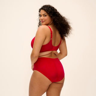 Model wearing Elomi Brianna full brief in Haute Red with matching half cup bra, back view