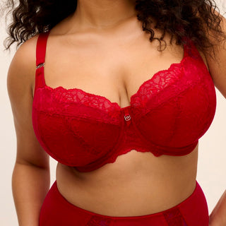 Model wearing Elomi Brianna half cup bra in Haute Red, close-up front view