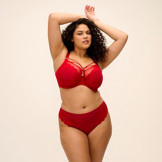 Model wearing Elomi Brianna plunge bra in Haute Red with matching thong, front view
