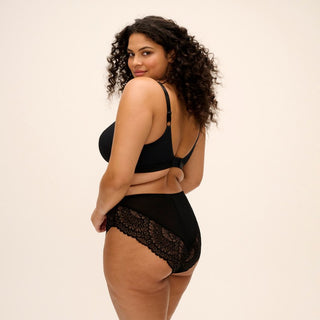Model wearing Elomi Tiernie non wired bralette in Black, back view