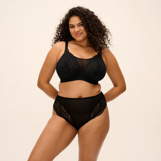 Model wearing Elomi Tiernie non wired bralette in Black, front view
