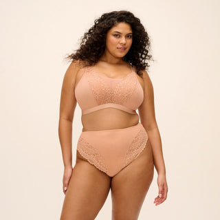 Model wearing Elomi Tiernie brief in Sahara Nude, front view