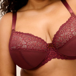 Close-up of model wearing Elomi Tiernie plunge bra in Tibetan Red