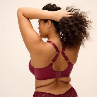 Model wearing Elomi Tiernie plunge bra in Tibetan Red, alternative view 1