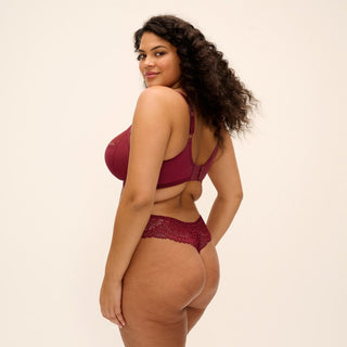 Model wearing Elomi Tiernie thong in Tibetan Red, back view