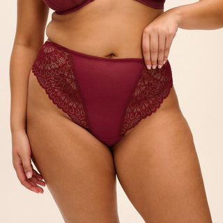 Model wearing Elomi Tiernie thong in Tibetan Red, front view