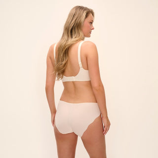Model wearing Fantasie Magdalena brief in Ivory with matching side support bra, back view