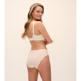 Model wearing Fantasie Magdalena moulded spacer bra in Ivory with matching brief, back view