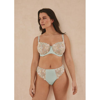 Lifestyle shot of model wearing Fantasie Magdalena balconette bra in Vintage Green with matching thong