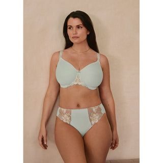 Lifestyle shot of model wearing Fantasie Magdalena brief in Vintage Green with matching bra