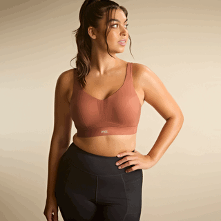 Lifestyle shot of model wearing Panache Endurance non padded underwired sports bra in Sienna Rose