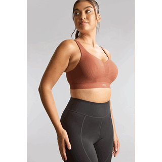 Model wearing Panache Endurance non padded underwired sports bra in Sienna Rose, side view
