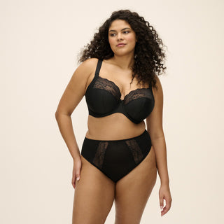 Model wearing Elomi Lucie Jet high leg brief and matching stretch plunge bra in black, front view
